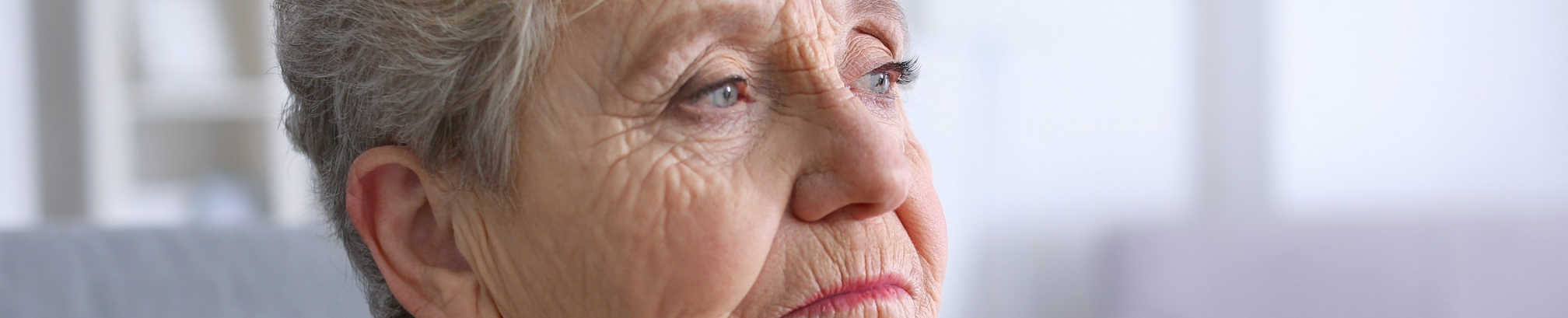 Elderly,Woman,With,Walking,Stick,At,Home